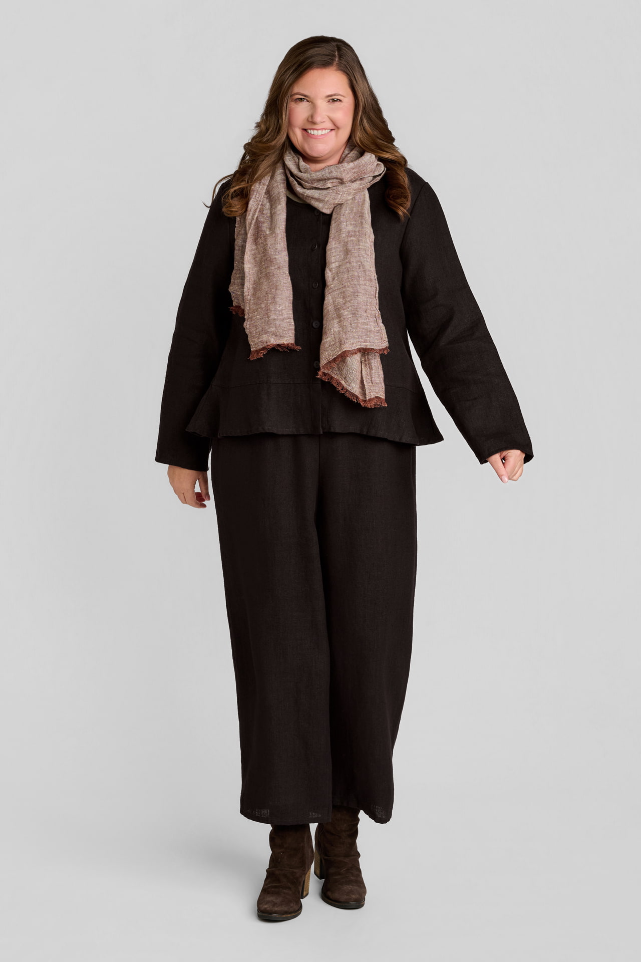 Woman in brown linen pullover with blown linen pants and brown linen scarf