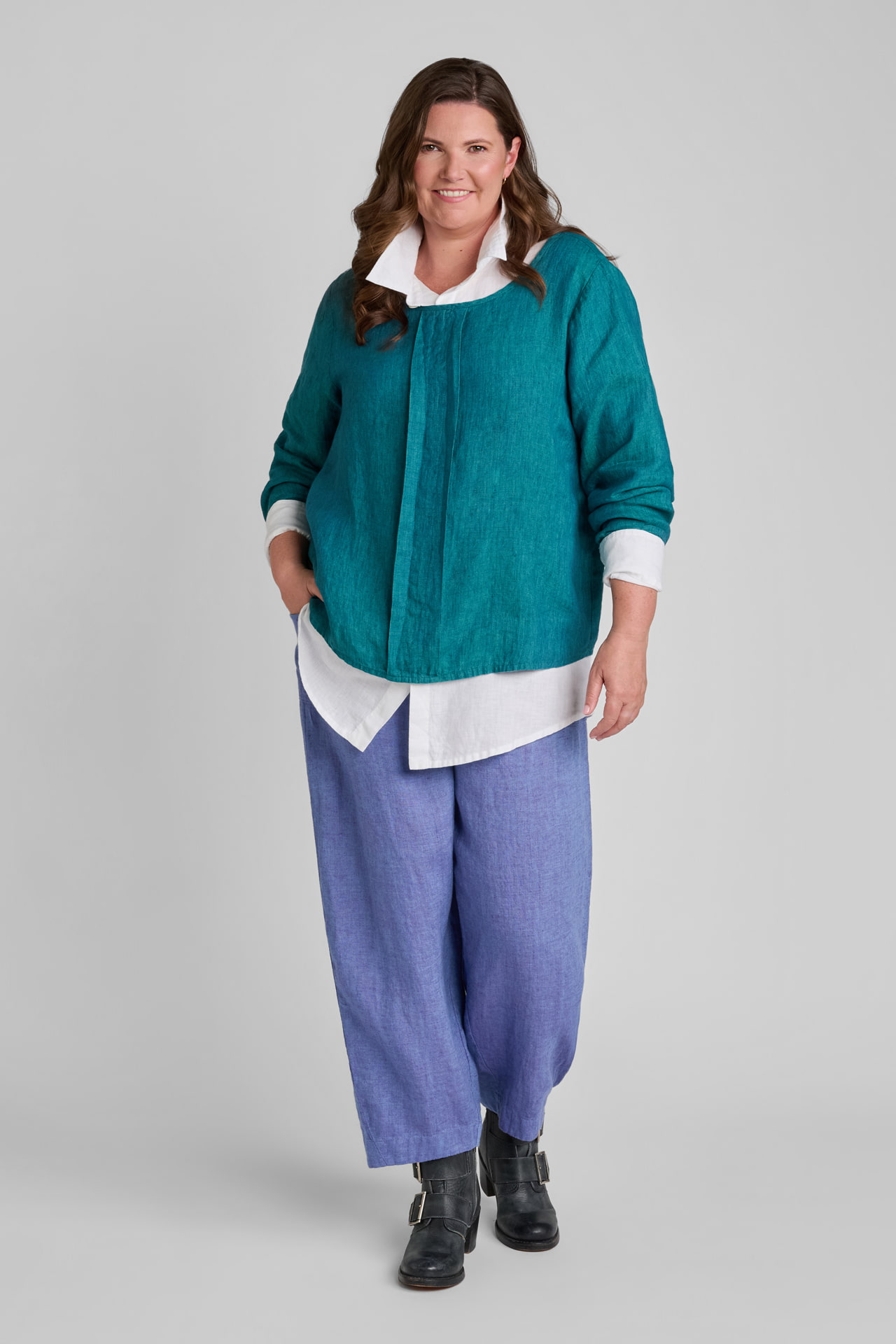 Woman in blue linen top and purple linen pants