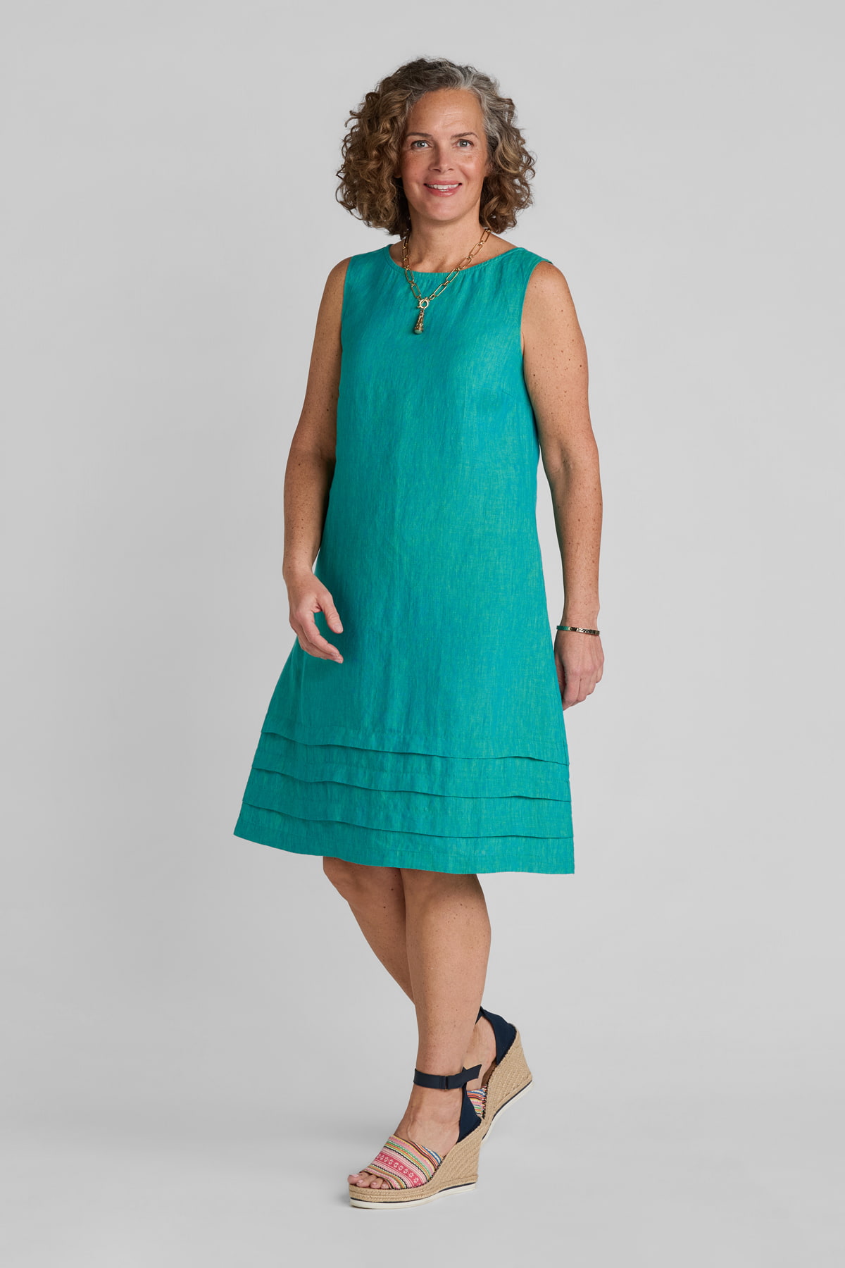 Woman in blue linen shift dress