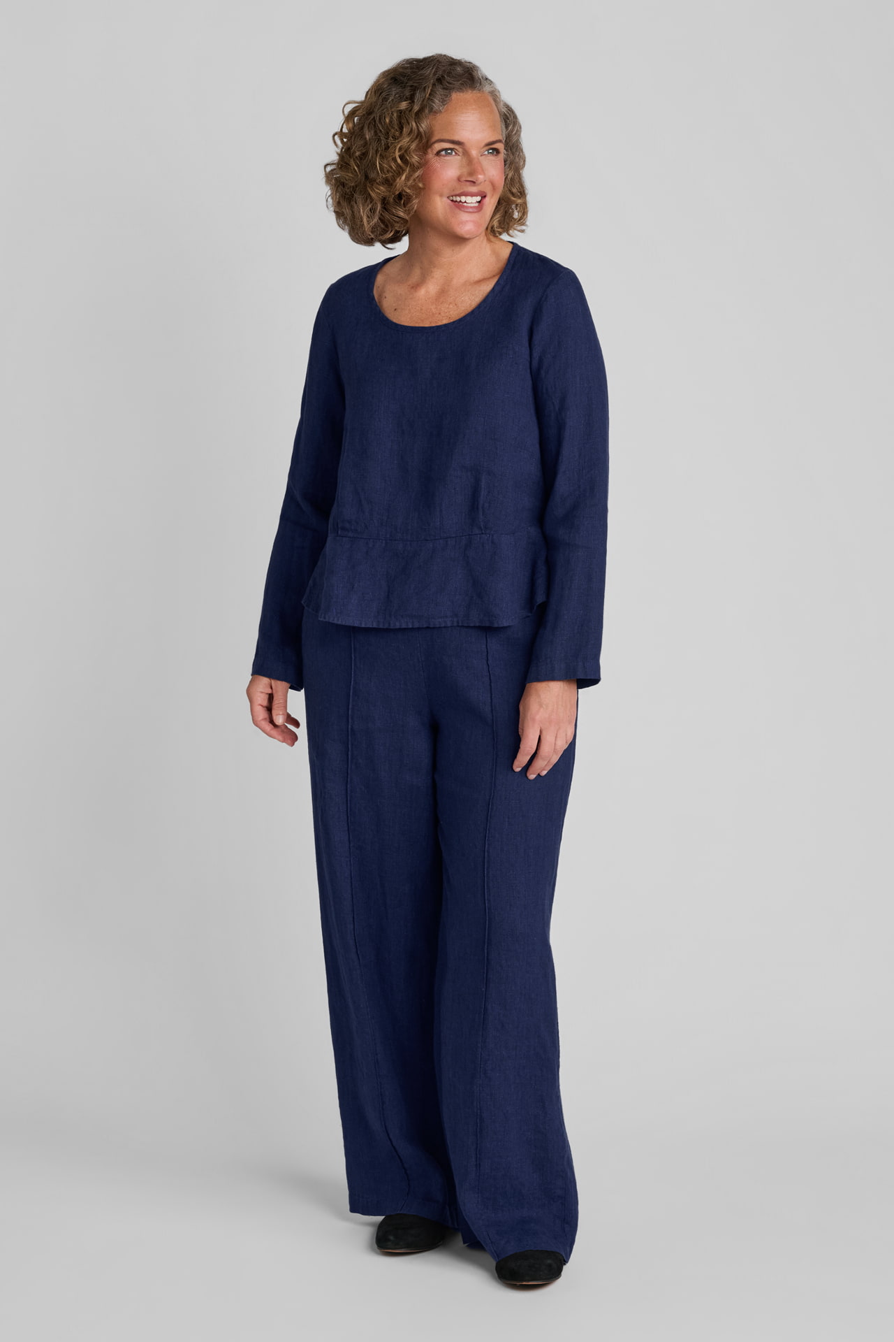 Woman in blue linen pullover with blue linen pants