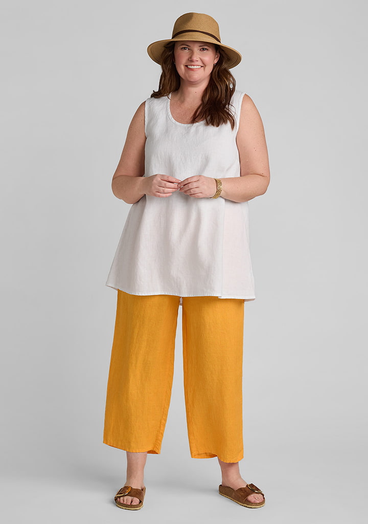 FLAX linen tank top in white with linen pants in orange
